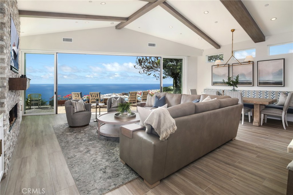 SINGLE LEVEL LUXURY LIVING OCEANSIDE OF COAST HIGHWAY! Located in the gated oceanfront community of Niguel Shores, this gorgeous single-level residence underwent a major down-to-the-studs reconstruction and expansion in 2022 and offers panoramic ocean, Catalina to San Clemente Island and incredible sunset views! The California coastal interior exudes a relaxed and casual vibe with meticulously executed high-end custom upgrades. The home features a dramatic great room/open kitchen concept, with surround sound, “distressed oak” wide-plank tile flooring, custom cabinetry and wine bar, indoor laundry room, A/C, water purification system, electric car charger and well-appointed stone finishes throughout. The gourmet kitchen showcases a stunning “Taj Mahal” quartzite slab island equipped with stainless appliances, wine chiller, pantry and coffee bar. The voluminous open living/dining room has a warm fireplace and walls of glass to enjoy the vast ocean vistas and opens to the back patio with a cozy fire pit and space to enjoy oceanfront sunsets 365 days a year! This luxury rental features 2 spacious bedrooms with 3 bathrooms including an ocean-facing master suite and en-suite bedroom with enormous walk-in closets and lavish spa-like baths. Picture windows and solar tubes bathe the spaces with natural light. Enjoy a warm shower outdoors after a dip in the ocean - just a few minutes away. Niguel Shores amenities include pool/spa, tennis/pickleball/sports courts, clubhouse, and a blufftop oceanfront park with direct access to the beaches below! Prime location! LOVE WHERE YOU LIVE! Rates vary depending on availability & season. Leased until December 2025. Leased January thru May 2026.