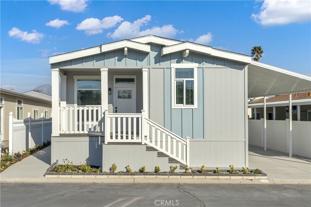 Discover this brand-new manufactured home in a welcoming all-age community in Ontario, CA. Enjoy a charming front porch—ideal for relaxing outdoors—and an open floor plan that connects the living, dining, and kitchen areas for a spacious, airy feel.
The kitchen features a central island, sleek stainless steel appliances, and plenty of room for cooking and entertaining. This thoughtfully designed home offers two guest bedrooms with ceiling fans and ample closet space, a full guest bathroom with a tub/shower combo, and a private master suite with its own en-suite bathroom for added comfort.
Perfect for families looking to create lasting memories, this home combines modern living with convenient access to local shopping, dining, and more.