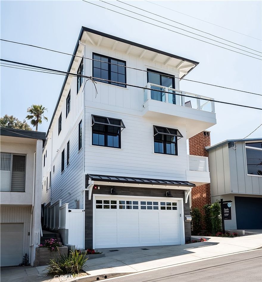 A stunning Coastal Plantation home in the heart of Manhattan beach! Enter through the charming dutch door featuring a guest bedroom, office/ secondary bedroom and a spacious media room. French oak hardwood floors sweep across the open concept floor plan filled with natural light. The second floor features a master suite with an ensuite bathroom and walk in closet, along with three additional bedrooms with own ensuite bathrooms and a laundry room. Take the 3 stop elevator to the top level where the open floor concept enjoys sweeping city and ocean views. Perfect for entertaining, the chef's kitchen features calcutta countertops, top of the line Thermador appliances and exquisite finishes. Relax & enjoy the sunset on the spacious balcony that blend indoor & outdoor spaces. Close proximity to all the amenities that downtown Manhattan Beach offers, award winning schools and so much more!