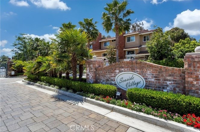 This is a rare find in a beach-close Huntington Beach location. This end-unit townhouse in Seaside Village has a private location on a quiet cul-de-sac in the rear of this quality gated community. It features a versatile floor plan containing 2 bedrooms, 2.5 bathrooms, as well as a large bonus room (11’ X 14’) upstairs that’s perfect for an office or guest bedroom, or could also be easily converted into a third bedroom. Just inside the front door is a sunny and spacious living room with dramatic vaulted ceilings that overlooks and opens to the rear outdoor living spaces. As a coveted end-unit siding to a wide greenbelt, this townhouse also features a private side-gate to the spacious patio & outdoor living-space in the rear of the unit. The Southwest orientation of the outside entertaining areas offers ideal exposure to sun and ocean breezes. You can walk from Seaside Village to the beach and the buzzing Pacific City/Downtown HB dining & shopping scene, yet quickly escape back to the tranquility of this well-maintained community. This home is a perfect combination of features and location. Plan on seeing it today!