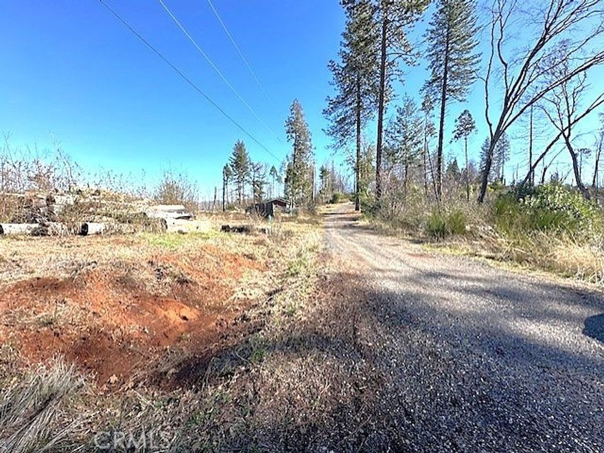 Looking for the perfect the place to build? Look no further! Three lots being sold together. Buildable One+ (approx. 1.12) acres with Existing Infrastructure in Berry Creek, CA (Butte County). Two lots had home's that previously stood prior to the fire, there is infrastructure to give you a head start on your dream. Two pads, two pre-existing septic systems and two wells already in place. Save time and costs on excavation. Perfect for those seeking a serene location with easy access to outdoor activities, this property is just 10 minutes from beautiful Lake Oroville, ideal for boating, fishing, and camping, and only 30 minutes from the amenities of Oroville. Zoned "VLDR" this land offers flexibility for your building plans. Easily acquire a permit to live in your mobile home or trailer while construction is under way on your home. Don’t miss this unique chance to own land with established infrastructure in the peaceful community of Berry Creek. You will find privacy and convenience. These lots are just off Lower Bald Rock Rd. with a short graveled road access to the lots. Parcels 062-440-009, 010 & 011.