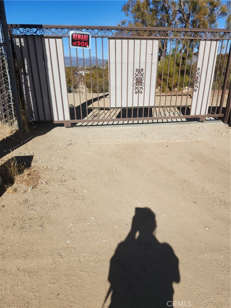 One of a kind 5 acre property. Gated for privacy and security. Nature's delight with nature and mountain views. Primary residence plus 2 other producing income rentals. Priced below market for a fast sale.