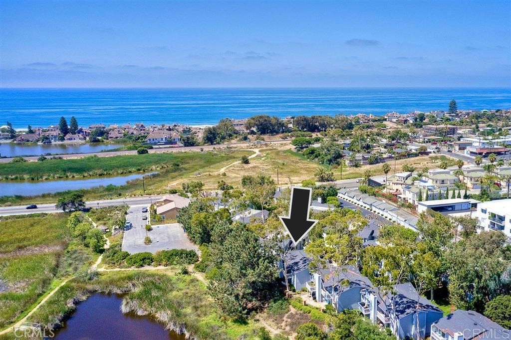 Furnished beach rental with perfect location!! Walking distance to Carlsbad Village and beaches (about 1 mile) and about 2 miles to Oceanside pier beaches and downtown. The property sits directly on the Buena Vista lagoon with your own private retreat to watch the birds come and go (a California estuary). It is a very spacious 2 bedroom with nearly 1800 SF all on the the one level, ground floor. Two parking spaces are yours during your stay. E bikes available as well for rent.
There are two separate semi- private patios overlooking the Buena Vista Lagoon. There is an association pool and spa, 1 covered secure garage, and 1 uncovered assigned parking. Separate dining area, kitchen and kitchenette dining area. There is a washer and dryer room. There is a double door entry to a large Master bedroom, retreat and large full master bathroom. Large Smart TV in the family room with fireplace and another smart TV in the 2nd bedroom. Cable TV and Wifi are included. This beach retreat is perfect to escape the beach crowds for rest, family time and peace.