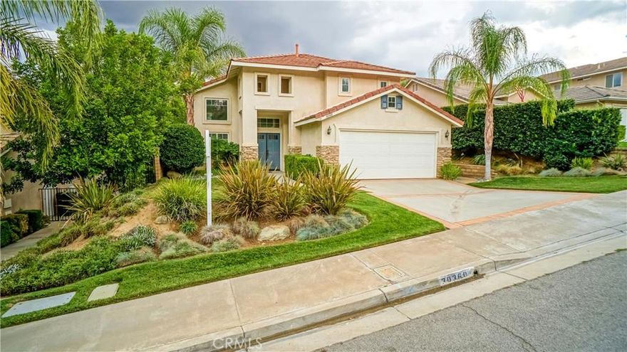 Santa Clarita home for sale, located just off of Hillcrest Parkway and Yosemite Drive in Castaic. Stacked stone accents grace the front exterior adding to the curb appeal. The brick ribbon driveway greets you as you arrive and enter through the elegant double door entry. The entry features warm wood-like floors and high ceilings. Next, you will find the formal living and dining rooms. The tastefully upgraded kitchen offers quartz countertops, recessed lighting, modern cabinetry, stainless appliances, and elegant tile backsplash. Just off of the kitchen is the family room with cozy fireplace and built-in media niche. Upstairs you will find the guest bedrooms, bathroom, and master suite. An upper sundeck overlooks the awesome entertainer's yard. The backyard is complete with sparkling pool and spa with rock accents and waterfalls. Plus gorgeous views grace the back yard, giving the feeling of your own island paradise. 100% OWNED SOLAR PANELS!!