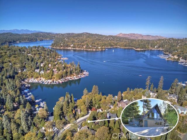 Classic A-Frame With Lake Views. Private drive with plenty of parking leads to this charming A Frame home that has been lovingly maintained and is ready for new owners. This 3 bed and 2 bath has a spacious kitchen with granite counters and stainless appliances. Large living area features hardwood floors, a stack stone fireplace and room for the whole family. In addition to the three bedrooms there are a few sleeping nooks for additional overnight guests. Great location close to the lake! Start building new family memories here.