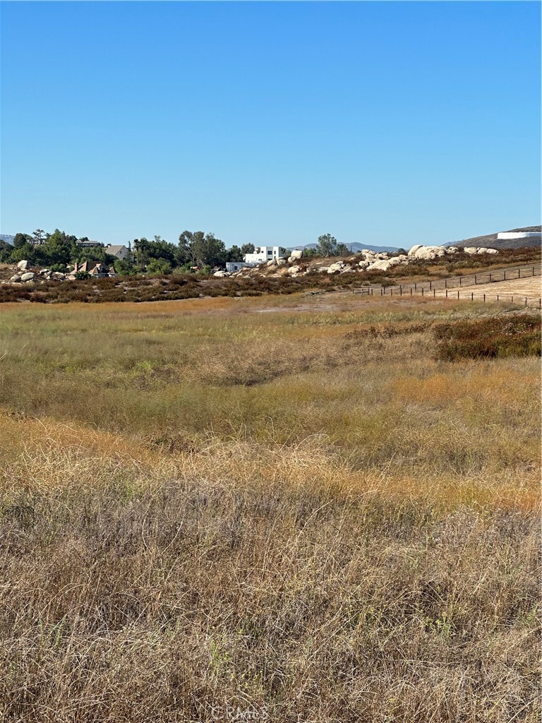 Gentle rolling 5.03 acres located 2 lots from paved Auld Road, and 3 lots away from paved Pourroy Road where all the tract homes are. Utilities in Mazoe Street. Perfect for custom/Manufactured home with room for horses. See environmental constraint sheet for flood plain on southwest corner of property.