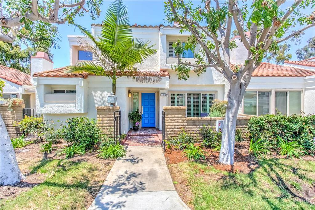 Tastefully remodeled to perfection this open and airy, two-story townhouse with vaulted ceilings is upgraded with large dual-paned windows and sliding doors leading to the front and rear patios. Eucalyptus hardwood floors, plantation shutters, a remodeled fireplace, and artistically inspired lighting throughout the home all add to the open feeling. The european-style kitchen equipped with stainless steel appliances, quartz counter tops, designer tile & a wine refrigerator is perfect for your cooking and entertaining needs. The two master suites upstairs each have in-suite bathrooms which are re-modeled with stunning fixtures, designer tiles and stone enclosures, new interior doors and glass closets with closet organizers. One of the largest models in the Villas, this home comes with a full-sized laundry room. Nestled between the Rancho San Joaquin golf course and tennis club, this home is the most sought after model in the Villas of Rancho San Joaquin. This home is ideally located close to award winning schools, world-class shopping, restaurants, an international airport and the freeway.