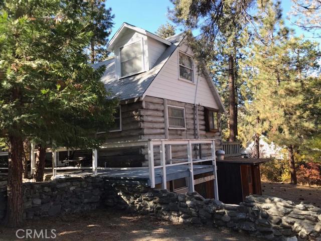 Authentic Log cabin. 3 bdrs, 2 full bths. Updated great room - kitchen cabinets, counters. granite fireplace. upstairs bedrooms with original hard wood flooring. Basement converted to livable space includes full bath and laundry room. front porch with granite, includes rear deck. fenced yard. located on level easy access lot Association Amenities: None # of RV Spaces: 0NONE Lot Location Type: Other Landscaping: Natural Special Features: None Basement: FINI # of Attached Spaces: 0 # of Detached Spaces: 0
