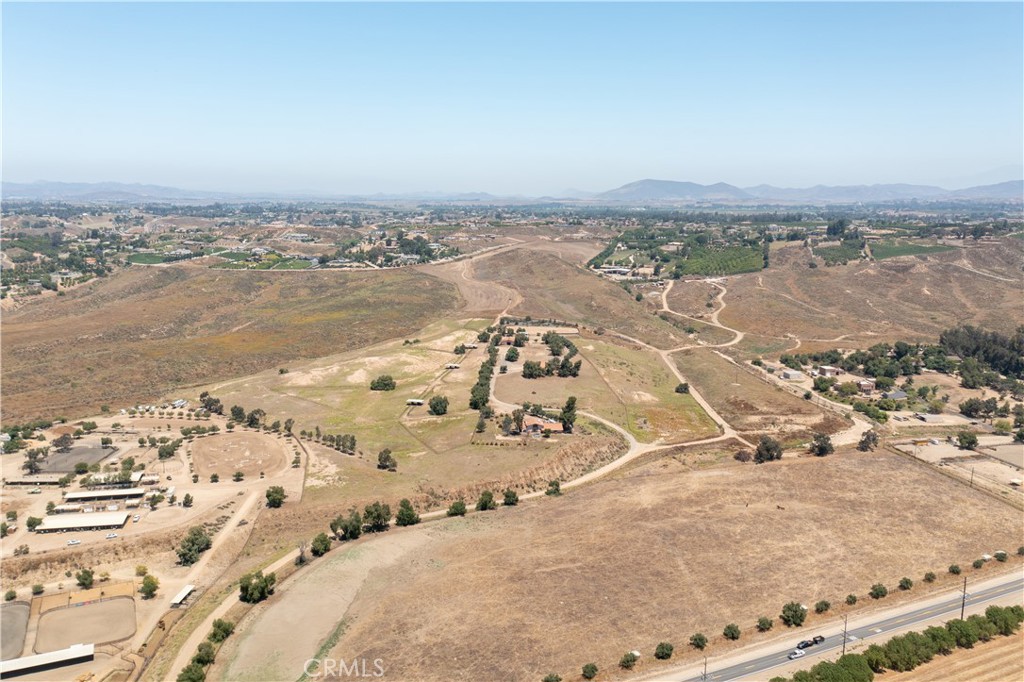 An extraordinary investment opportunity in the heart of Temecula Wine Country, The Hat Ranch spans 144 acres of pristine land, offering unmatched potential for a luxury hotel, private estate compound, high-end equestrian facility, boutique winery, or world-class event venue. Situated in the prestigious Valle de los Caballos, this two-parcel property presents a rare chance to develop a premier destination in one of Southern California’s most sought-after lifestyle markets.
A Visionary Development Opportunity
144 Acres of Versatile Land – Ideal for a boutique resort, wellness retreat, luxury estate compound, high-end equestrian facility, or an exclusive winery and event venue.
Prime Location in Temecula Wine Country – Positioned in the coveted Valle de los Caballos, surrounded by multimillion-dollar estates, award-winning wineries, and elite equestrian centers.
Hotel & Hospitality Potential – With sweeping vineyard views, private estate potential, and space for resort-style amenities, this property is perfectly suited for a luxury retreat or boutique hotel.
Equestrian & Estate-Ready Infrastructure – Features a 5-stall barn with a tack room, catering to high-net-worth equestrian clientele.
Infrastructure in Place – City supplying sewer lines for large scale development, equipped with two septic systems, 3" and 1.5" water meters, on-site electricity, and gas lines at the property line, making development seamless.
Redevelopment Potential – Two existing structures offer the opportunity for renovation, expansion, or complete reimagining.
Why This Property is a Game-Changer
With Temecula’s rapid growth as a luxury lifestyle destination, The Hat Ranch presents a strategic investment for developers, hospitality brands, and visionary investors. The region is home to thriving wine tourism, elite equestrian sports, and high-net-worth homeowners, making it the ideal setting for an ultra-private resort, corporate retreat compound, or exclusive hospitality venture.
Unrivaled Market Positioning
One of the largest land offerings in Temecula’s premier wine and equestrian region.
Surrounded by multimillion-dollar estates, top-tier wineries, and exclusive country clubs.
Proximity to major freeways and Southern California’s affluent leisure and business travelers.
Positioned for exceptional value appreciation in a high-demand luxury market.