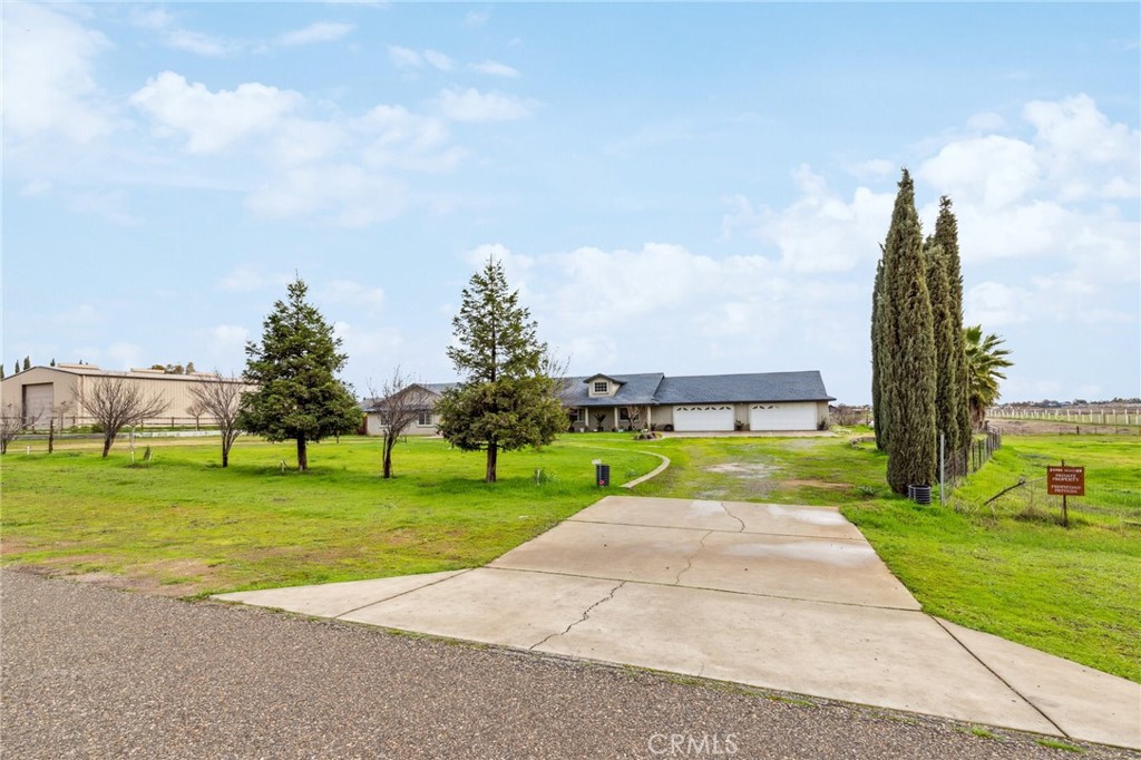 Spacious 5-Bedroom Ranch Home with over 3,000 square feet on 4.45 Acres with 4-Car Garage, and Open Floor Plan
Welcome to this stunning 5-bedroom, 3-bath ranch home, perfect for families looking for space and comfort. Situated on 4.45 acres, this property offers ample room for outdoor activities and permits large animals, making it ideal for those seeking a country lifestyle. Home is 53 mi. from Yosemite National Park and only 8 miles from the upcoming Casino in Madera!!
The open floor plan with vaulted ceilings seamlessly connects the living, dining, and kitchen areas. Cozy up by the fireplace in the living room, or relax in the 2 primary bedrooms that are huge in size like the living room. One of the primary bedrooms has been used as a second living room.
The 4-car garage offers plenty of space for vehicles, storage, or even a home gym. With generously sized bedrooms and bathrooms, this home is designed for both functionality and style. Plus there is a bonus room with a bathroom isolated from the home done in a good workmanship manner but with permits unknown.
Step outside to a large patio in the backyard with plenty of concrete, perfect for entertaining guests, family gatherings, or simply enjoying a quiet evening outdoors. The property also features a convenient U-shaped driveway in the front, providing easy access and additional parking. Both sides of the home are spacious enough to drive in to the back yard! Per original homeowner, solar panels are leased with up to $350 monthly payment.
Don't miss the opportunity to make this beautiful ranch property your forever home!
Pictures (50)