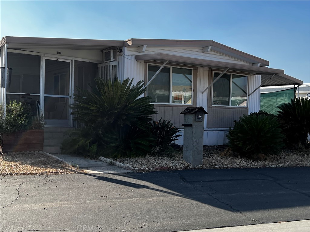 PRICE REDUCED!!! Beautiful!! 2 Bedroom PLUS Den...1560 Sq Ft...Fully updated...DryWalled, with extra insulation...
Ceramic floors ... Laundry room too..Loads of cabinets in this one! Built in Hutch...attached Sunroom with Ceramic floors too.
Large Living room has lots of windows to view mountains...sometimes with snowcaps!
Has built in attached generator, to power the whole unit, in case of Power failure. A/C, Heater AND Swamper
This is a rent controlled park...so very little raising of space rent allowed. Pool, Spa recreation building
with many activities. Grassy areas for walking pleasure..or pets. Call agent for appointment.