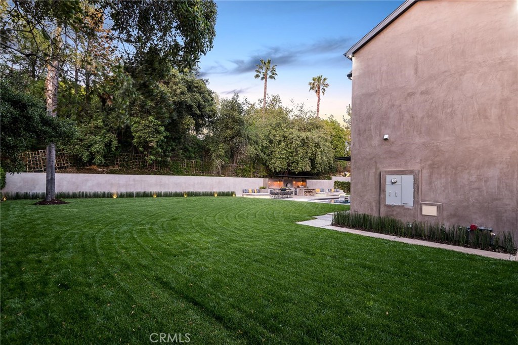 Architectural custom built estate featuring approx. 10k square feet of upscale living on an exceptional 23,500 square-foot lot in the heart of coveted Royal Oaks in Encino.