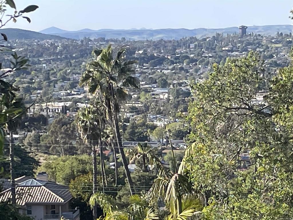 Beautiful .25 acre parcel on Grossmont in La Mesa's Mount Helix neighborhood. Access directly from El Granito Ave, sloping upward to a level pad from which views to the north and Cowles Mountain expand to the east and west. Numerous native trees and bushes flank the parcel, including oaks and rare pines. Please call to visit the property and marvel at its exceptional charm. Located south of Fuerte Drive with quick access to I-8 and Hwy 125. Surrounded by estate homes and lush greenery. The site offers seclusion while accessible to all desirable amenities. Buyer to perform all due diligence.