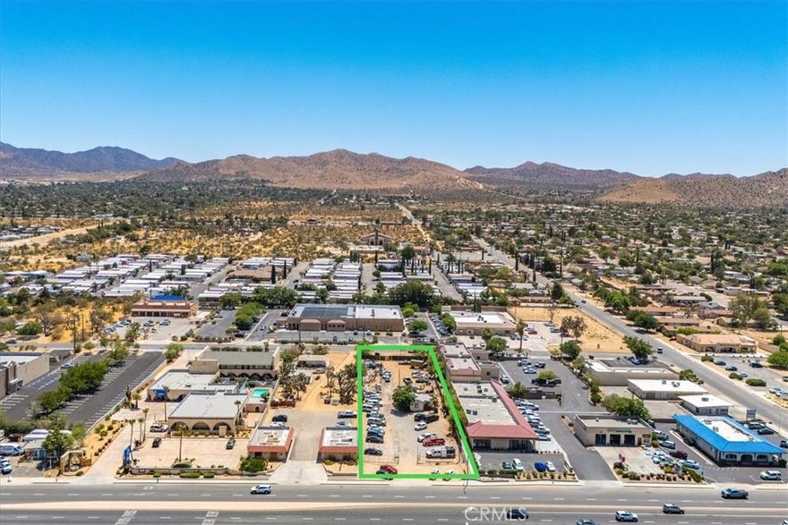 COMMERCIAL, HIGHWAY FRONT PROPERTY near center of Yucca Valley. Located on the desirable southside of Highway 62/29 Palms Highway, to capture traffic entering Yucca Valley, with a right turn directly into the property. Nearly 1-Acre (.82-acre to be exact, or 35,721 square feet, including 92’ of highway frontage and 389’ deep). Caltrans permitted ingress and egress both on the highway and the backside of property which borders Pima Trail. Currently a Used-Car Dealership, but can be utilized for many other business purposes. Highway 62/29 Palms Highway is one of Southern California’s major highways, leading to – among other places – Joshua Tree National Park, with an estimated 3 million visitors passing this property to visit the National Park, not including traffic of likely several million more per year for local commuting, travel to and from the Marine Base in 29 Palms, etc. Priced competitively at $750k, presenting an opportunity to secure an investment in this burgeoning and fast developing area of Southern California. With a growing population and a newly installed sewage treatment plant to service Yucca Valley, long term appreciation looks bright. Buy now while still affordable.