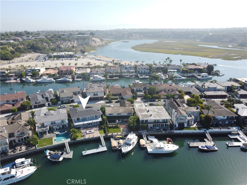 Traditional Dover Shores bayfront in premier lagoon location. The home features 5 bedrooms plus a den, 3.5 bathrooms, nearly 3,700 square feet of living space, on a large, 6,000 square foot lot with spacious rear yard. Enjoy the large back patio with private boat dock that can accommodate a Duffy or large yacht. The highly desired South facing bayfront location provides some of the most spectacular sunsets around. Enjoy the homes close proximity to award wining schools, multiple private beaches, Newport Aquatic Center, Fashion Island, and all the amenities 17th street has to offer!