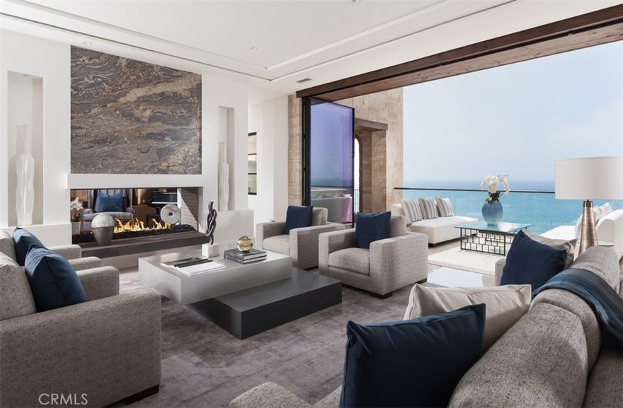 9 Strand Beach Drive is a new construction, front row, oceanfront estate in the exclusive Strand community. Built in a modern-Mediterranean style, that sits ocean frontage with direct beach access.  This rare estate enjoys panoramic ocean views and Catalina sunset views from virtually every room. This magnificent property includes 8823 square feet of resort style living on three spacious levels. The top level is inclusive of a large master retreat, his-her walk-in closets, walk-in shower, stand alone tub, with fireplace setting and balcony embracing views of the Pacific Ocean. This level also has four additional en-suite bedrooms with a open area for family entertainment.  The middle level is graced with Chef's Kitchen which is equipped with the finest stainless steel appliances by Miele, butlers kitchen, morning room all open to the family area, with fireplace and a private library. Among the properties additional distinctive features is a bottom level complete with Theater, an additional family living area with wet-bar and wine wall, in-door out-door loggias to an infinity-edge pool with spa, beach shower, built-in BBQ that continues on to the surf-sand and beyond.  The property also boast an elevator for easy access to all three levels. To showcase an extensive collection of automobiles is a 6 car garage with aprox 1369 sq ft for the car aficionado at heart. Within close distance is resort style amenities to include Strand Beach Club, epicurean dining and 5 Star Resorts.
