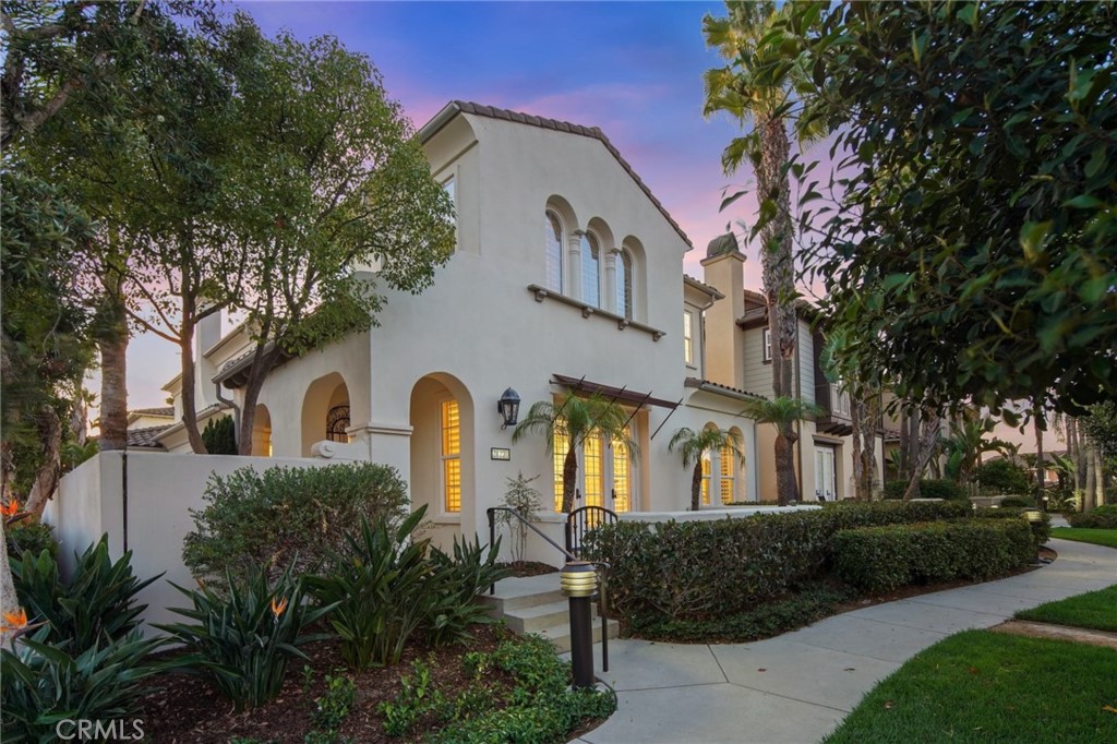 Escape to your own private resort by the California coast, 500 yards from surf & sand, let the rhythm of the waves become the soundtrack of your life. Nestled behind the exclusive gates of “The Waterfront” is the perfect home for a family or the ideal getaway destination. Enter through the romantic arches leading to a private patio and formal entry. This property is superbly situated on a corner location, offering unique privacy with only one neighbor on one side and large greenbelt for your front yard, feeling like a single family home. With over 3450 sq.ft. of spacious beach living, the main level consists of an oversized living room with high ceilings & french doors, easily turned into a downstairs 3rd primary suite for in-laws or generational home, with a tranquil front patio overlooking the green landscape and trees, a perfect spot to enjoy your morning coffee. Enjoy gathering in the generously sized family room off the kitchen and adjacent to the formal dining room, providing you ample lounging and entertaining options. The open access to the outdoor retreat lets you capitalize on the indoor-to-outdoor experience and fresh ocean breezes. On the second level you'll find 2 ensuite primary retreats, along with an additional bedroom and bath, a large loft/2nd family room which could be the 4th bedroom (closet ready). A large laundry room and separate office area complete the upper level. The 3 car oversized garage offers plentiful storage for all your beach accessories. The resort-style pool, spa and entertaining terrace are steps away, along with Pacific City, cafe’s, shopping and endless beach sunrises and sunsets. Don’t hesitate to make this your generational BEACH HOME.