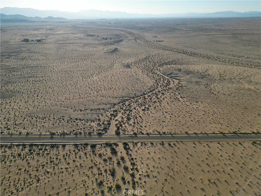 Welcome to your very own desert paradise in the beautiful Wonder Valley area of 29 Palms! This incredible land parcel spans an impressive 30 acres, offering you a vast canvas to create your dream oasis amidst the enchanting desert landscape.
Conveniently located close to power, this land presents an excellent opportunity to bring your vision to life with ease. Imagine the possibilities of designing your ideal off-grid living retreat, where you can enjoy the freedom of independence while still having the option to connect to the grid when desired. The potential to drill a well for a sustainable water source adds to the allure of this remarkable property.
Situated just a stone's throw away from the mesmerizing east entrance of Joshua Tree National Park, you'll have endless opportunities for exploration and adventure right at your doorstep. Immerse yourself in the captivating beauty of the park's iconic Joshua trees, awe-inspiring rock formations, and diverse wildlife. Indulge in hiking, rock climbing, stargazing, or simply find solace in the tranquility of nature's embrace.
While this land offers a sense of serene seclusion, it also provides easy access to in-town amenities. 29 Palms boasts a vibrant community, offering a range of conveniences, local services, and cultural events to enhance your desert living experience. From eclectic shops and restaurants to art galleries and community gatherings, you'll find a welcoming atmosphere that celebrates the unique spirit of this remarkable area.
Discover the joy of waking up to golden sunrises and basking in the breathtaking sunsets that paint the desert sky with vibrant hues. Let the gentle desert breeze guide your thoughts as you immerse yourself in the boundless inspiration that this enchanting landscape offers.
With its vast expanse of land and proximity to both natural wonders and in-town amenities, this parcel in 29 Palms is a gateway to a life filled with adventure, creativity, and tranquility. Embrace the opportunity to create your own off-grid haven, where the harmony of desert living and modern comforts intertwine seamlessly. Your dream desert retreat awaits!