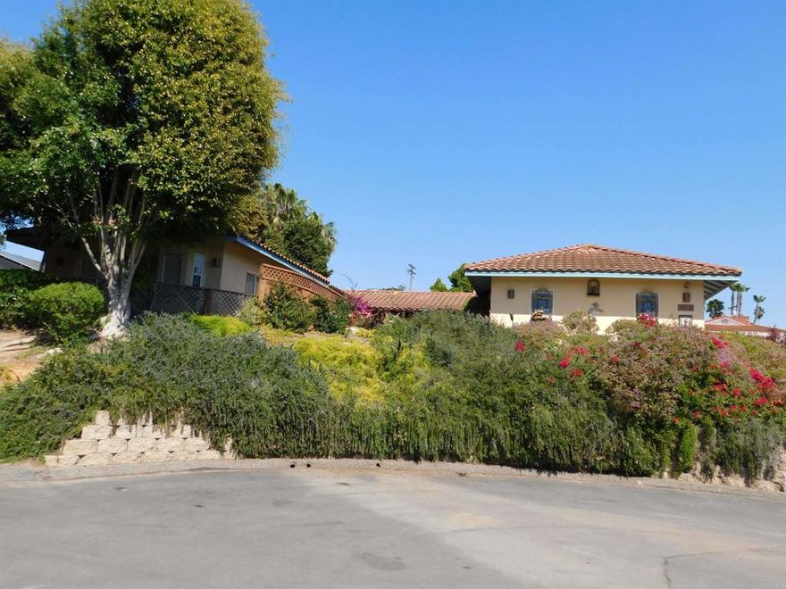 Designed And Built By The Owner, A Local Artist. This 1600 Sq. Ft. 3 Bedroom And 2 Bath Unique Oceanview Home Has A 400 Sq. Ft. 1/1 Attached ADU Unit (Granny Flat). The Home Has A South-West Architecture Flair. Most Of The Home And The ADU Flow Through Large Sliding Glass Doors To 5 Large Patio Area Around The Home, Which Opens Up The Home, Bringing The Outside In. The Property Has Many Other Facets To It; There are 2 Outbuildings 2 11’x 10' And A 13'x 9' That Were Used For An Office And An Art Studio Just Off The Main Back Cover Patio. The Attached 2 Car Garage Has A Work Bench And Plenty Storage Shelves. The Driveway And Upper Part Of The Property Has A Lot Of Room For Off Street And RV Parking With Hook-Ups. There Is Plenty Of Room For The Family's Recreation And Outdoor Toys. The Home Sits Just Above Eugenie Ave Cul-D-Sac, Which Allows It To Enjoy The Ocean Views And Breezes. The Interior Floors Are Beautiful Mexican Saltillo Pavers In The Living Areas And Wood Floors In The Bedrooms. The Kitchen, Bathroom Counters And Showers Have Unique Hand Painted Tiles Throughout. The Large 28' X 18' Living Room And Dining Area Have A 11’ Cathedral Ceilings With A Dramatic Fireplace. The 20 'X 13', 17' X 15' And 13' X 12’ Bedrooms Are At Opposite Ends Of The Home Giving Everyone Plenty Of Privacy.  There Is A 5th Wheel With A Deck In The Rear Of The Property, The Owners Call It A Casita And Is Being Used For Guests And Family When They Visit And Will Remain With The Sale At No Value. The Location Of This Home Is Just Blocks To The Paul Ecke Sports Center, The Magdalena Ecke YMCA Family Center, Close To The San Diego Botanical Gardens And San Dieguito Heritage Museum And Just Minutes To The Ocean And Moonlight Beach.  Please Refer To The Pictures, It Will Help You Capture The Essence Of The Home. You Must Visit The Home To Really Appreciate It.