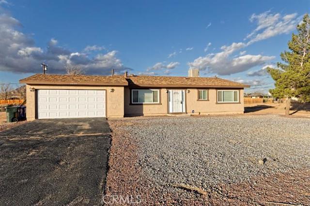 This freshly painted MOVE IN READY 3 bedroom 2 bathroom is located in a quiet Apple Valley neighborhood, close to shopping and within walking distance to a park. Don't let the age of this home fool you, it has recently been updated and upgraded with custom kitchen cabinets, including a pantry with pull out shelves, an island counter, tile flooring and French doors with built in blinds. The master bedroom has mirrored closet doors and a custom closet system. Master bathroom has a tiled shower/ Jacuzzi tub combo. Blinds on all windows, both central A/C and evaporate cooler on a thermostat newer hot water heater, recessed lighting, over-sized two car garage fenced back yard and more. Termite inspection already completed and septic pit to be replaced before close of escrow. Association Amenities: None # of RV Spaces: 0 Special Features: ,,PTRY,WSEC,SHNONE Lot Location Type: Standard Location Landscaping: Natural Special Features: Cable TV,Garage Door Opener # of Attached Spaces: 2 # of Detached Spaces: 0