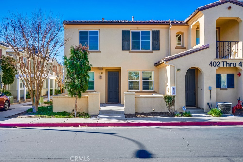 Stunning two-story townhouse in the highly sought-after Lake Pointe neighborhood, offering resort-style living and picturesque surroundings. This charming property features 3 bedrooms, 2.5 bathrooms, a gated front patio, and a 2-car attached garage with direct access. Large windows throughout the home bring in an abundance of natural light. The modern kitchen, complete with a breakfast bar, flows effortlessly into the dining area, which opens to a covered deck through sliding glass doors, offering tranquil views. The inviting great room is enhanced by a cozy fireplace. The primary suite boasts a walk-in closet and an ensuite bathroom with dual vanities and a tub/shower combo. A convenient hallway laundry closet adds to the home's practicality. HOA amenities include a pool, playground, and picnic area. Ideally located with easy access to the 15 Freeway, close to shopping, dining, and downtown Lake Elsinore. VA-approved condo with a low tax rate!