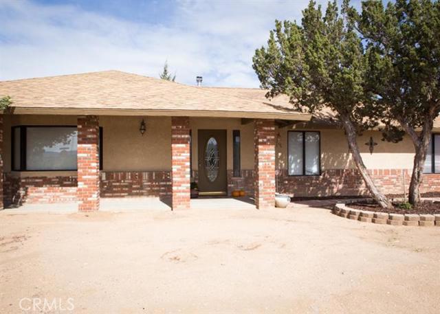 **Great Home in Hesperia** on Ranchero Road. This home features 3 bedrooms and 3 baths. Elegant entrance leads you to this large home with many upgrades: Formal dining room, Spacious large kitchen, Granite counters tops with lots of cabinets in the kitchen. Extra den includes own bathroom and, which you can use as an office or 4th bedroom for extended family or guests. CORNER LOT WITH FENCED YARD FOR PLAY AND ENTERTAINING. Huge covered patio to enjoy summer with your family and friends. Newer Central A/C. This home shows beautifully & has been very well maintained with many interior updates. Close to everything - schools, shopping and the freeway for commuters. Take a look, there is a lot more here than meets the eye. This is dream home you must see!!!! Association Amenities: None # of RV Spaces: 0 Special Features: BN,,NONE Lot Location Type: Standard Location Special Features: Cable TV,Garage Door Opener # of Attached Spaces: 2 # of Detached Spaces: 0