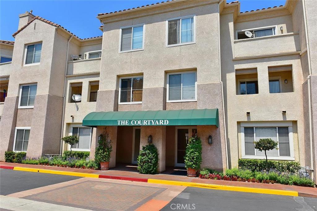 This sharp single level condo in the 62+ senior community in the Courtyard of South Hills is rare find and perfect for independent senior living. The resident must be 62+, but the buyer's age to purchase is unrestricted. The unit offers 2 br & 2 ba and is meticulously maintained by the original owner. It is located on the 3rd floor and has a nice view of the lush courtyard. It is in move-in condition with fresh paint and new carpet. The bright living area has a fireplace and is open to the kitchen. The kitchen offers built-in appliances. The master bedroom has a balcony, a large walk-in closet and a spacious bathroom. The door to the hall bath is wide to accommodate a wheel chair or walker. The laundry is inside the unit. The grounds and common areas are manicured and well maintained. The serene courtyard has a gazebo, BBQ's and spa. There is also an impressive community room with a kitchen, plenty of seating, a library, and a piano for community activities or private gatherings. The complex has an elevator for easy access to all floors. There is a trash chute and the unit has a storage area. The HOA dues include water, trash, fire insurance, and maintenance of the common areas. The complex is gated and the unit has a covered parking space.