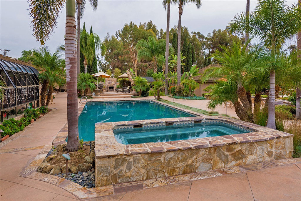 Sprawling Private Gated .73 Acre Oasis is The Perfect Family Compound. Single story Main house is beautifully appointed with Formal Entry, hardwood floors, Gourmet Kitchen, Study, Formal Dining Room, marble fireplaces, luxurious Master Suite & Spa, 2nd Master Suite & a Separate Studio with private bath. Plus+ Detached 1 Bedroom Casita! Large Workshop & office. Breathtakingly beautiful backyard with Sparkling Pool & Spa, outside Patio, bar & fireplace, mature trees - plenty of room to relax. Solar Owned. Neighborhoods: Pepper Tree Equipment: Range/Oven, Vacuum/Central Other Fees: 0 Sewer: Septic Installed Topography: LL