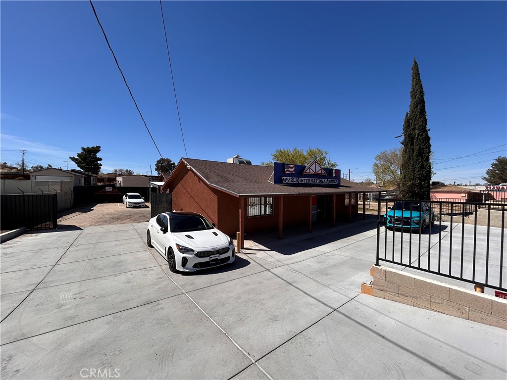 Rare opportunity to own a commercial office building with prime frontage on Hesperia Rd. in Victorville, CA. Located at 14258 Hesperia Rd., this property features a ±1,081 SF main office building, a detached two-car garage, two driveways, and approximately ±7,800 SF of outdoor space. Situated less than a mile from the intersection of Green Tree Blvd. and Hesperia Rd., it offers excellent accessibility throughout the Victor Valley. With a C-2 General Commercial zoning designation, the property supports a wide range of potential uses. Buyer to verify all information contained herein.