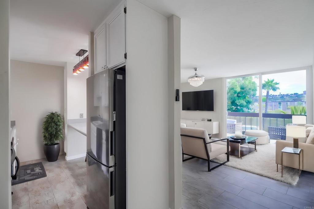 Super Rare Opportunity to buy one of the best properties in the entire development! This is one of only six units total in the complex that are 1) on the top floor, 2) southern facing, 3) 2 bedroom homes 4) with a deck overlooking the interior resort grounds. This unit is also located in the middle of the building which makes it as quiet a location as you could possibly have. The bedrooms are both good size, and both have southern exposure. The bathroom and the kitchen have both been updated. The special condo provides a light and bright living space throughout. This resort style property lets you vacation at home. As soon as you enter the interior grounds of this gated community you will feel and see everything available for your enjoyment. Stroll around the resort grounds complete with water fountains, lush landscape, water ponds, and plenty of locations to relax and enjoy the atmosphere. Go for a swim and jacuzzi, or just relax poolside and soak up some sun. And when you are feeling active, get up for a game of tennis, or volleyball, get a workout in the complete gym, or try out all the fun that the game room has to offer. The home also includes the following New windows and sliding doors New electrical panel New vinyl floors New ceiling fans with lights & remote controls in bedrooms New hardware in kitchen bathroom and vanity New fridge New shower fixtures Walls and Ceiling painted Solid Wood Kitchen and bathroom cabinets were stripped and repainted Pipes cleaned out in kitchen and bathroom (precautionary) Come and see what your new lifestyle could be while this speacial property is still available for purchase.