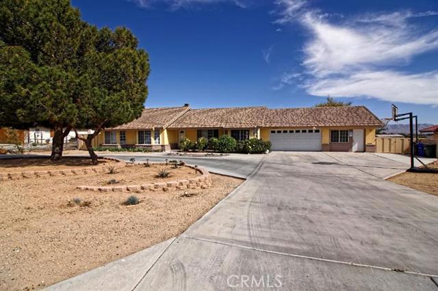 JUST REDUCED! This beautiful Ranch Style home has lots of room, has wonderful views of the city and mountains and is in a very desirable area of Apple Valley. Pride of ownership shows all over! 4 bedrooms - one was added on (is permitted) that could be a Mother-in-Law or Guest quarters. The Master bedroom and bathroom are huge, there is a bonus room/office space in the front and there is a Formal Dining Room/Family Room. This home has a wonderful floor plan! There is landscaping front and back - tiered planters, an area for a garden, a dog run and RV Parking! The spa also stays. Come and see this beautiful home! Association Amenities: None # of RV Spaces: 0 Special Features: CC,,PTRYNONE Lot Location Type: Standard Location Special Features: Garage Door Opener # of Attached Spaces: 2 # of Detached Spaces: 0