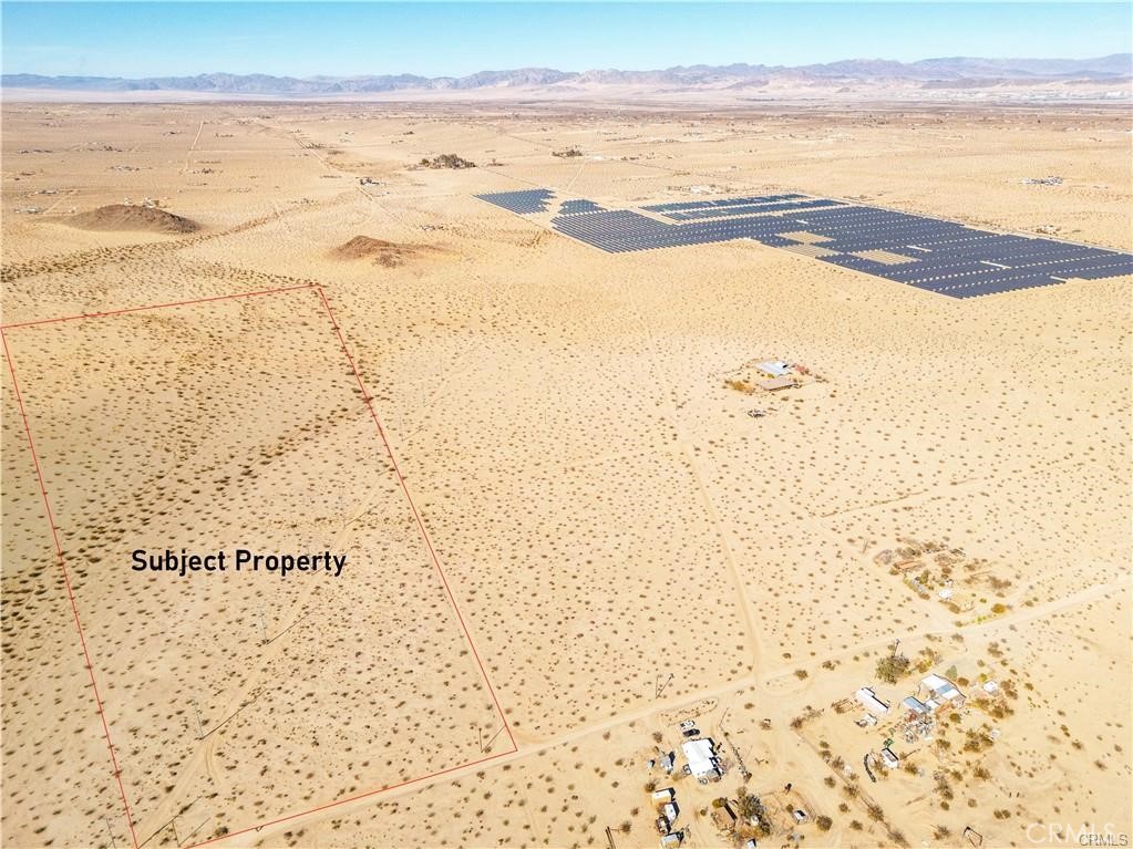 This exceptional 40-acre lot in western 29 Palms offers a rare opportunity to own prime real estate just minutes from the Joshua Tree border. Ideally located near paved roads (Lear Ave and Hwy 62), the property provides easy access while maintaining a peaceful, secluded atmosphere. With water and electricity services nearby and 3-phase electric poles crossing the southern boundary, it’s ready for development. The land is nearby some charming ranch homes making this land a great opportunity for farmland and offers stunning views of Copper Mountain to the west. Located just minutes from the Indian Cove entrance to Joshua Tree National Park, and with city water lines within 600 feet (buyer to verify), this property holds incredible potential for creating your dream home or a serene getaway making this a fantastic opportunity you won't want to miss!