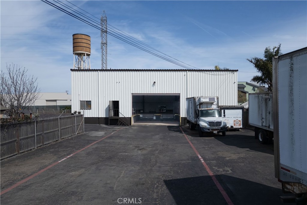 Coolest-Cool Storage in town. The property is gated and has an open concrete parking area with room for delivery trucks to park overnight. A very large warehouse with several office areas, a restroom, and 3 refrigeration areas. The previous occupant/owner was a long-time resident and a well-known Sausage company. This is a "rare" find to buy a warehouse with a raised loading dock/receiving bay, level with delivery trailer floors for expedient loading and unloading. So many uses for this building like manufacturing, food prep and storage, winemaking and storage, shipping and receiving. Great Value.
