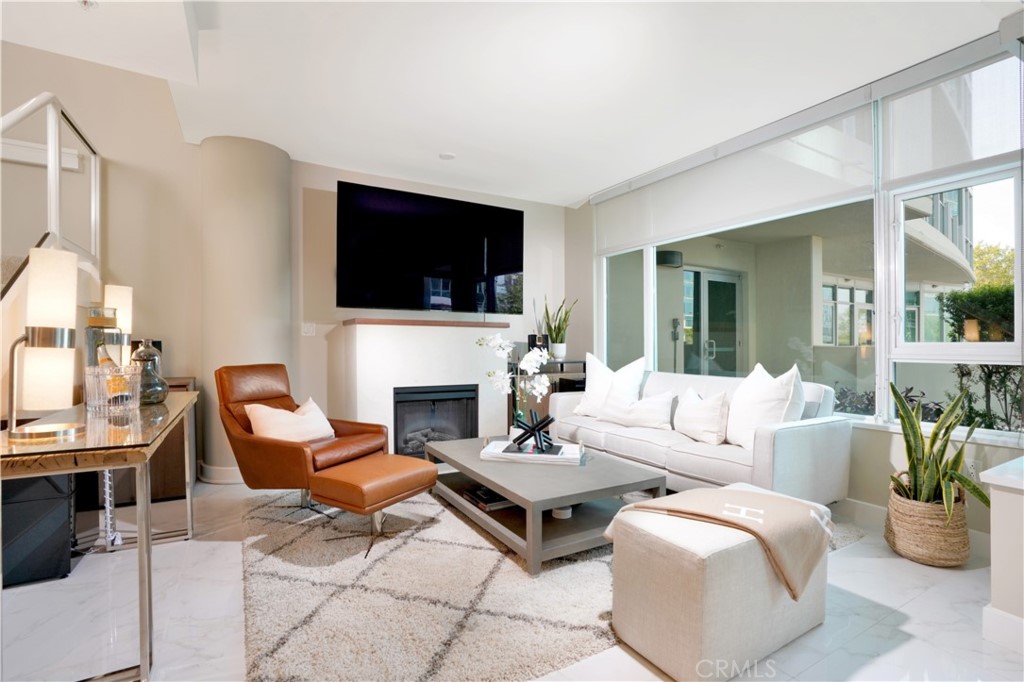 Welcome to luxury OC high rise living in Marquee Park Place, a premier location. This 2 story townhouse-style unit is 1 of only 4 townhomes in the building. Occupying space on floors 3 and 4, this generous 2 bedroom, 2.5 bathroom home affords all the benefits of luxury, high-rise living without the hassle of neighbors above or below. This smart floor-plan includes an upgraded kitchen, floor to ceiling glass on both levels with sunshine and views, a large walk-in closet in primary bedroom, ample storage closets throughout and in-unit washer/dryer. Upgrades include custom California closets throughout, new carpet, new dishwasher, smooth ceilings and walls throughout, new paint and upgraded lighting throughout. This is the only unit in Marquee to have two side-by-side reserved parking spots on the ground floor. Marquee luxury amenities include 24/7 guard gated security, concierge services, swimming pool, spa, billiards, business center, lounge, fitness center, theatre, BBQ area, and children’s playground. This convenient location also puts you close to everywhere you need to be in the OC. HOA dues cover internet, trash, water and gas.