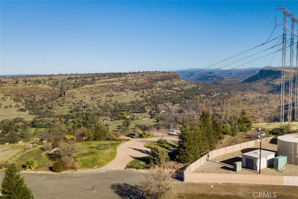 Create your dream home in the beautiful community of Rocky Bluffs! Tucked away behind a gated community, this 1.11-acre property is professionally landscaped, offers a full paved driveway and is just waiting for someone to build something spectacular. It previously had a 3 bedroom, 2.5 bath that stretched over 2,700 sq. ft. With views of the canyon, privacy of the neighborhood and situated at the end of a cul-de-sac, this is an opportunity that doesn’t come around often. Do not let it pass you by!