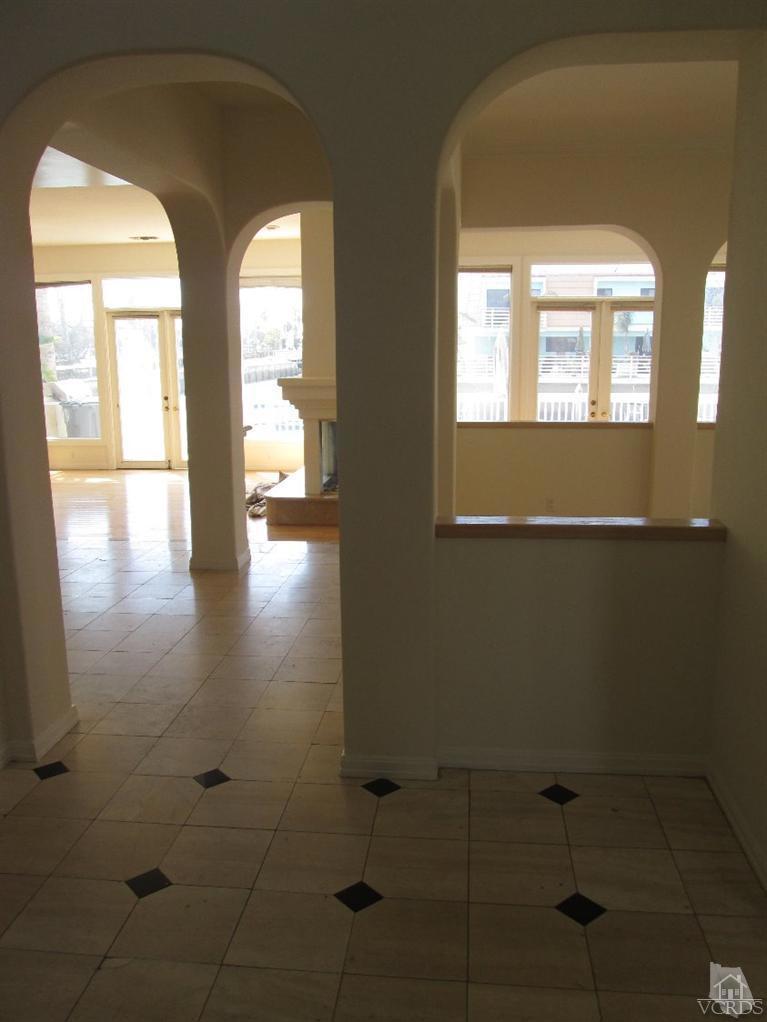 3bd 2 3/4 bath Single Family home in Leeward Estates with a boat dock on Mandalay Bay (Channel Islands Harbor). Large open living/kitchen/dining area downstairs. French doors open out onto the huge deck with direct private access to the dock (40 ft easement). Fresh paint and new carpet, some ceramic, stone and wood flooring. Large master with huge walk in closet. Granite counter tops, huge kitchen island. Fireplaces in both the living room and Master bedroom. Jacuzzi tub in master bath. There is also a den/office space on the ground floor. Attached two car garage, washer dryer hookups. No pets please.