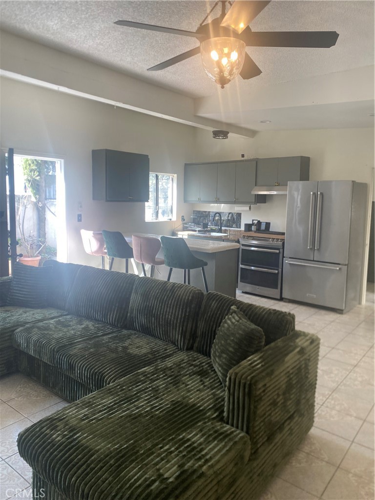 Welcome to this spacious two-story home in the highly sought-after Tujunga neighborhood. Featuring 6 bedrooms and 5 bathrooms, this property offers plenty of space for a growing family or an excellent multi-generational living setup with rental income potential. The main house has 4 bedrooms + a bonus room, 3 full bathrooms, one ¾ bath, and a half bath for guests. The front portion of the home is a separate 2-bed, 2-bath unit with its own private entry—ideal for rental income or extended family. This property offers ample parking with a 2-car garage and 5 additional uncovered spaces. Enjoy paid-off solar panels (8-10 panels) for reduced electricity costs. The home features a front patio for outdoor activities, a small private backyard, and 2 cozy balcony for relaxation. Recent upgrades include fresh interior and exterior paint, two remodeled bathrooms in the main house, a newer roof (2 years old), HVAC system (4 years old), and solar panels installed 1 year ago. Cozy up to the fireplace in the main living area. The property is equipped with 220V electrical for added convenience. Located in a prime Tujunga location, this home offers the perfect balance of comfort and accessibility. Close to parks, schools, and local amenities—everything you need is right at your doorstep. Don’t miss this incredible opportunity—schedule a showing today!