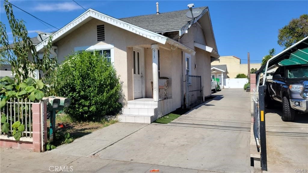 GREAT OPPORTUNITY!! This property could be for investors or owner occupied who wish to live in the primary house and rent the back unit for supplemental income. Each home has separate gas, and electrical meters. The front house has three bedrooms and one bath and a separated 2 car garage. The back Unit has one bedroom and one bath, living room and kitchen area. This duplex is in a zone R3. Do not miss it!