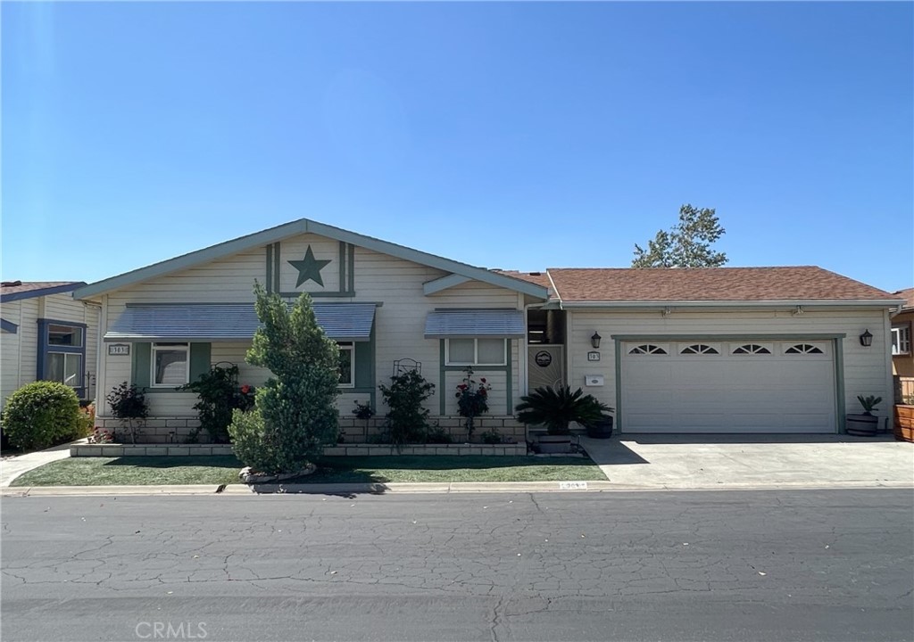 Large 3 bedroom 2 bath home with, one of the signature models of "Silvercrest". This home has a family room, living room, dinning area, eat in kitchen which actually has a spectacular view. The fireplace is in the family room that has an open floor plan so you can certainly visit with your company and share the fireplace in the winter months. The master bedroom has a retreat area with shelves/drawers and cabinets for either your clothes or crafts, either one would work. The master bath has a 60" shower, dual sinks and a separate bath tub. The 12X40 room addition is a plus! there are drawers, counter space, 2 sliding glass doors, a heat pump, capped ceiling, remote control fans and finished floor, the storage goes without saying. 2 car garage is finished on all sides including the ceiling, the ceiling has additional storage and built in shelves, great for that person that likes doing special projects. The back yard has fruit trees, flowers & shrubbery all on a drip system that is hooked up to an automatic timer and the front yard has artificial turf for low maintenance.