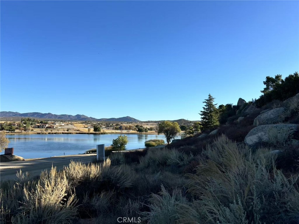 A beautiful lake front lot with 2.75 acres of land situated in a safely gated community. With a view of the 55 acres Lake Riverside, San Jacinto Mountains and the surrounding valley, the lot has everything for the location of a perfect home. For example, the lot is located in the community of Lake Riverside Estates with a lake-side playground, private air strip, community pool, and a boat dock. There are also community equestrian facilities, where you can enjoy horseback riding, or you can go hiking in the mountains.