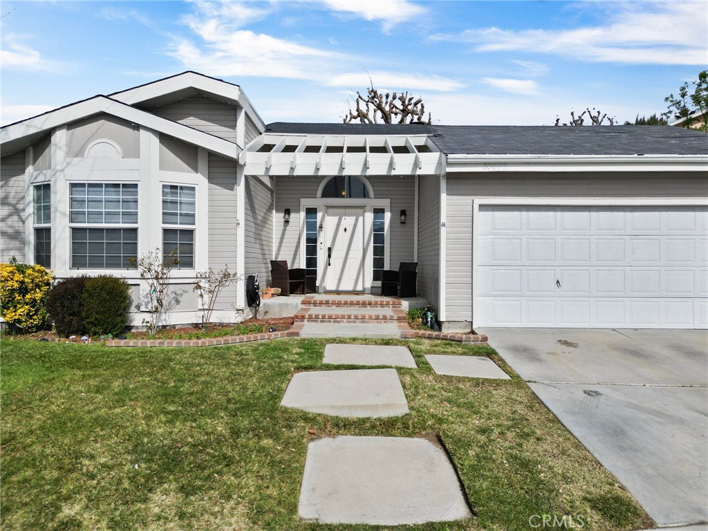 Welcome to this beautifully upgraded home located in the heart of Canyon Country. This spacious 2-bedroom, 2-bathroom residence offers an open and inviting floor plan, modern upgrades, and incredible mountain and valley views—making it the perfect retreat for families and entertainers alike. Step inside to discover a bright and airy living space, featuring high ceilings, recessed lighting, and elegant flooring throughout. The gourmet kitchen is a chef’s dream, boasting granite countertops, stainless steel appliances, ample cabinetry, and a center island—ideal for preparing meals and gathering with loved ones. The adjacent family room with a cozy fireplace provides a warm and inviting ambiance, perfect for relaxing evenings. The primary suite is a true sanctuary, offering stunning panoramic views, a spacious walk-in closet, and a spa-like en-suite bathroom with dual vanities, a soaking tub, and a separate walk-in shower. The additional bedroom is generously sized, providing plenty of space for family, guests, or a home office. Step outside to your private backyard oasis, where you can unwind and enjoy the scenic views. Whether you’re hosting gatherings or simply enjoying the California sunshine, this outdoor space is designed for both relaxation and entertainment. This home is located in a highly desirable neighborhood and offers easy access to top-rated schools, shopping, dining, parks, and hiking trails. Plus, with convenient freeway access, commuting to the greater Los Angeles area is a breeze. This is your chance to own a gorgeous, move-in-ready home in one of Canyon Country’s most sought-after communities. Don’t miss out—schedule your private showing today!