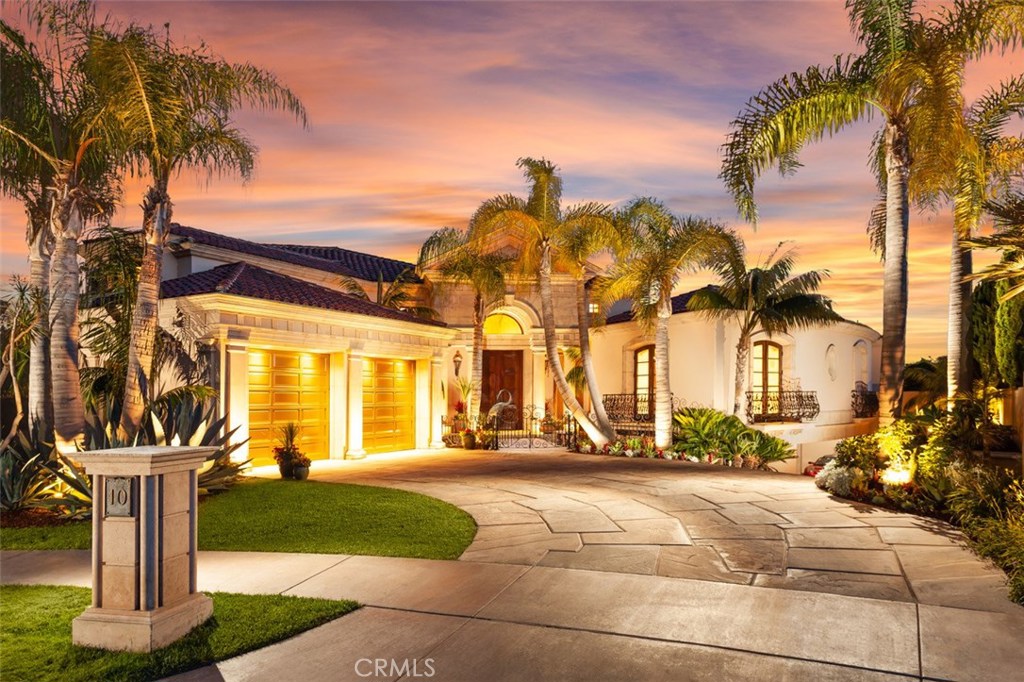 With commanding views of the Pacific Ocean, private beach access and a prestigious location in a gated enclave adjacent to the world-famous Pelican Hill Golf Course, this private Mediterranean estate is without compare. Set at the end of a quiet cul-de-sac in Newport Coast’s only oceanfront community, the estate is an artful blend of classic architectural forms and exquisite high-end amenities. Meticulously designed and perfectly executed, this inviting and stately residence is graced with a sophisticated and timeless exterior and a beautiful array of outdoor living areas, including an ocean-view pool and spa. The open interior is equally impressive, with distinctive barrel-vaulted ceilings, arched doorways, an extravagant master suite and upgraded bathrooms. Approximately 5,246 s.f. with 4 bedrooms, 3 baths and 2 powder rooms, the estate recently underwent an extensive renovation, utilizing the highest quality materials, finishes and technology. The move-in ready residence includes a main-floor bedroom suite, all-new flooring, a new fireplace, a stunning custom kitchen, and a ground-level 2-car garage in addition to subterranean parking for 8. Entertain in the massive outdoor dining pavilion with colonnade, enjoy the beauty of a large koi pond, relax on the ocean-view lanai, hike the Crystal Cove trail to the private beach, or take a moment to wander the lush, professionally landscaped grounds, which span approx. 15,129 s.f.