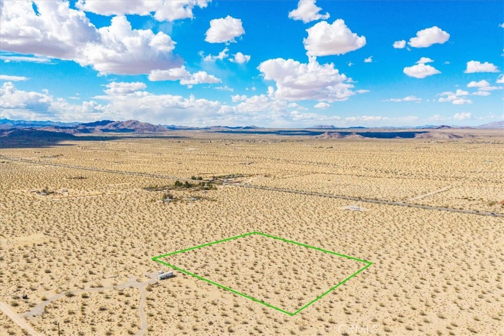 2.5 Acres with Breathtaking Views Near Panorama Heights – Joshua Tree, CA
Escape to wide open skies and stunning desert beauty with this 2.5-acre parcel nestled near the Panorama Heights area of Joshua Tree. Surrounded by iconic rock formations, rugged mountains, and sweeping panoramic views, this property offers the perfect blend of tranquility and inspiration. Whether you're building your dream home, a weekend getaway, or a desert retreat, this location delivers the ultimate Joshua Tree experience.
Ideally located just minutes from Joshua Tree National Park, Friendly Hills Park, and the Desert Conservation Area, outdoor adventure is right at your doorstep. Access is easy from 29 Palms Highway via Cottonwood Drive, putting you within reach of local amenities while still enjoying peaceful seclusion.
The property offers endless stargazing, dramatic sunsets, and a front-row seat to the raw, natural beauty of the high desert.
Buyer to verify utility availability and property boundary lines.