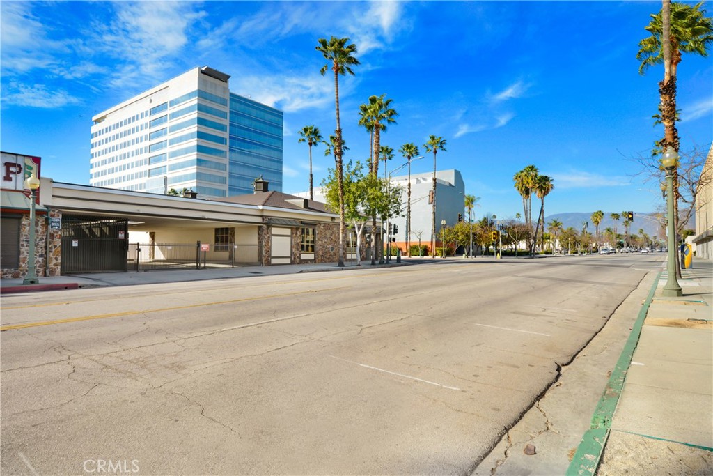 LANDMARK SITE for Sale. Prime Corner Office Building in Downtown San Bernardino sitting on 0.81 Acres. This iconic property presents an unparalleled opportunity in the heart of San Bernardino. Positioned near key landmarks such as Bank of America, the Mexican Consulate, San Bernardino County Courthouse, City Hall, and the California Theatre of the Performing Arts, the building offers unmatched visibility, accessibility, and the potential to become a landmark in the area. The property consists of three parcels:1.- APN 0134-241-61(approx. 12,191 sqft lot), encompassing the main building; 2.-APN 0134-241-62 (approx. 18,883 sqft lot), designated for the parking lot; and 3.-APN 0134-241-17 (approx. 4,420 sqft lot), an alley/easement road providing seamless access to both the building and parking lot. The main building spans 12,999 sq. ft. of durable concrete construction, ensuring long-term reliability and low maintenance. The remodeled main floor, approximately 7,000 sq. ft., is thoughtfully designed with a large reception area, front desk, foyer, conference rooms, private offices of various sizes, cubicles, phone stations, data room, multiple A/C zones, and men’s and women’s restrooms. Safety and security are paramount, with features including perimeter fencing, automatic metal roll-up doors and window covers, a high-value walk-in safe with a depository door valued at over $100,000, a security guard booth, and gated access doors with multiple codes. The building’s history as a former bank further highlights its robust security infrastructure. The finished basement, approximately 6,500 sq. ft., offers exceptional versatility. It includes underground parking, additional offices, conference rooms, meeting areas, and men’s and women’s restrooms. Finished with acoustic ceilings and walls, the space is ideal for storage, rental use, shelters, or banking operations. Parking is a key advantage, with a total of 73 spaces, including 58 open spaces and 15 covered spaces, ensuring convenience for employees and visitors alike. Positioned in a thriving downtown corridor with proximity to major businesses, government institutions, Metrolink, and cultural attractions, this property is ideal for office use, storage, or income generation. Its excellent condition and meticulous maintenance make it ready for immediate operational use. Don't wait. All information provided is deemed reliable but not guaranteed. Buyers are advised to conduct their own due diligence.