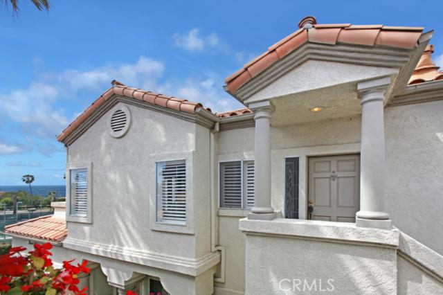 Gorgeous transitional contemporary ocean view condominium in Monarch Beach's exclusive Tennis Villas. Expansive and panoramic views of ocean, Catalina Island, trees, hills, city lights, sunsets, tennis courts and world-renowned St. Regis Resort & Spa just across the street. Perfect location for enjoying the best South Orange County has to offer - walking distance to Salt Creek Beach, Monarch Links Golf Course, St. Regis and Ritz Carlton. Laguna Beach is also just minutes away. This beautifully remodeled upstairs condo is spacious, open, light & bright with amazing views and located adjacent to the Tennis Club. Sit down ocean views from the master bedroom, balcony and living room! The kitchen opens up to the living area with no view obstructions facing the living area. Top of the line stainless steel kitchen appliances, wine refrigerator, sleek cook-top and oven, microwave, dishwasher and beautiful wood cabinetry throughout home. Balcony off of kitchen faces east - perfect for BBQ and plants; laundry room, balcony facing west off of living room and master, guest bedroom with spacious closet, plantation shutters throughout, remodeled bathrooms, two-car garage with storage plus permitted guest parking. Private, gated community with association pool and spa.