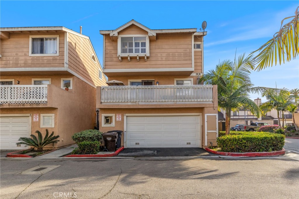 Get ready to fall in love with your new home in Huntington Park! Tucked away at 2915 E 60th Pl #S, this rare end-unit townhouse—with no common walls—delivers privacy and modern charm in spades, making it an absolute steal for first-time homebuyers or young families ready to upgrade their lifestyle. This 2-bedroom, 2.5-bathroom stunner welcomes you with an incredible split-level floor plan, showcasing an airy, open-concept living space bathed in natural light and crowned with soaring ceilings. The expansive kitchen is a chef’s delight, featuring a formal dining area, abundant cabinet and counter space, and a sliding glass door that opens to a private balcony overlooking the sparkling pool—your new favorite spot for morning coffee or evening cocktails. Retreat to the coveted primary en suite, complete with a walk-in closet ready to house your entire wardrobe, while both generously-sized bedrooms impress with high vaulted ceilings. All bathrooms have been recently renovated with sleek, modern touches that elevate everyday living. The oversized 2-car garage offers direct access, in-unit laundry, and plenty of storage to keep life organized. Step outside to your private backyard patio, perfect for hosting barbecues or letting your pup play in this pet-friendly community. The location is unbeatable -- central to spots like DTLA and near cool local joints for eating, shopping, and hanging out! This urban living townhouse hits that sweet spot between city vibes and cozy comfort. This gem won’t last long—call now to schedule your private tour before this beauty is gone!