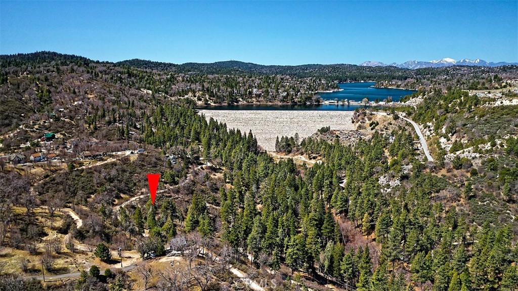 Situated in the tranquil mountain community of Cedar Glen, this remarkable lot offers a unique chance to own a piece of unspoiled natural beauty. Surrounded by towering pines and the crisp, fresh mountain air, this property provides an idyllic setting for building your perfect retreat or vacation getaway. Whether you're looking for a peaceful escape from the daily grind or an outdoor adventure hub, this location has everything you need. Revel in hiking, fishing, and exploring the picturesque trails of the San Bernardino Mountains, all just minutes from your front door. Lake Arrowhead is only a short drive away, offering easy access to boating, watersports, and a variety of charming shops and restaurants. With Cedar Glen's blend of rustic appeal and modern conveniences, it's the perfect destination for both full-time residents and weekend adventurers. While utility and lot details should be verified, this land holds incredible potential for the right buyer. The peaceful surroundings and proximity to year-round recreational activities make this an excellent investment in a sought-after mountain community. Whether you dream of a cozy cabin or a custom-designed mountain home, this lot offers the perfect space to bring your vision to life.