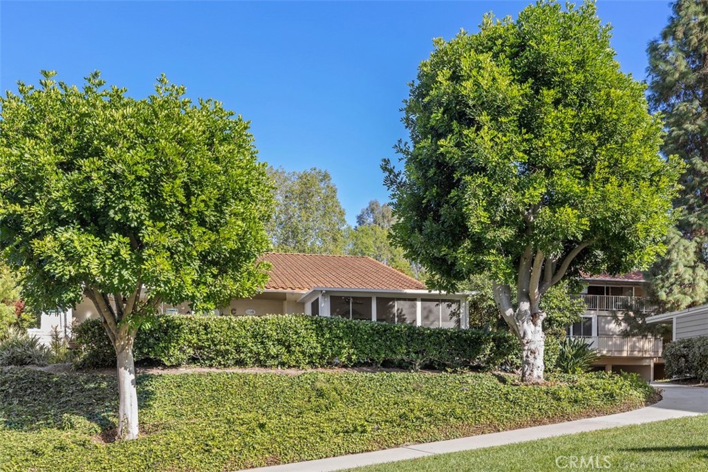 Exceptional one-of-a-kind custom home in a SPECTACULAR NOB HILL LOCATION! Privately surrounded by Greenery and Beautiful Landscaping. The "NEW SEVILLE" Model has 2 Master Bedroom Suites. One on the main floor and the other Expanded Master Suite upstairs plus a Loft with a Custom Office and cabinets. This home was completely remodeled with designer-selected finishes and highly upgraded fixtures throughout. The bedrooms have been expanded out with 3 closets added and new windows in addition to a Newer Mitsubishi Heating and A/C System with 3 Air Handlers. Wonderful Vaulted Ceilings in main living areas, smooth ceilings, custom window coverings, recess lighting, and Pecan Laminate Wood Flooring in the Kitchen, Dining/Living Room, and Stairs. Enjoy the Beautifully remodeled Kitchen with a 4' X 8' Island, Granite countertops, a Bay Window with an Electric Window Shade, a Warming Drawer, and a Trash Compactor. In addition, a Stackable Washer and Dryer, Custom-Designed Built-ins, Plantation Shutters, Recessed Lighting, and Bullnose Corners throughout... Thoughtfully designed with abundant storage in multiple areas. This is a Wonderful feeling home with a covered patio off the living room to enjoy. GREAT HOME FOR ENTERTAINING! Parking is close and a Beautiful Approach while walking to the front door. Available homes for sale in Laguna Woods Village are still pretty low, so don’t miss taking a look at this one before it is gone! MUST SEE! Add all this to the amenities offered by Laguna Woods Village and you have a winning combination -- 27 hole championship golf course or the 9-hole executive par 3 courses, tennis, paddle tennis, pickleball, lawn bowling, 2 fitness centers, 7 clubhouses, 5 swimming pools, equestrian center, gardening opportunities, art studio, world-class woodshop, over 200 clubs and organizations ensure you will never get bored here! Plus, free bus transportation around the community and nearby shopping and bus trips. Also, there is a very economical RV storage area to park your RV. Country Club Living is at its BEST and just approximately 6 miles from beautiful Laguna Beach! There is something for everyone to enjoy in this resort-style city. *SEE VIRTUAL TOUR* (The CARPORT #664 SPACE 3)