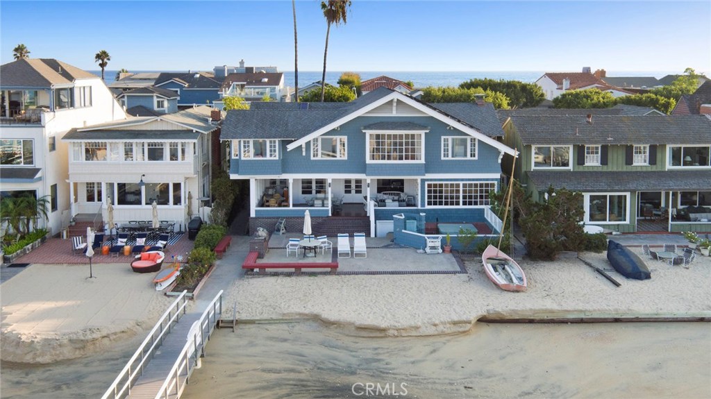 Charming vintage Balboa home spanning sixty feet of frontage along the most revered stretch of the Peninsula bay front. With many of the original architectural details intact this extraordinary waterfront home awaits a new owner with vision to restore an iconic piece of Balboa history for the next generation to enjoy. Grand, open floor plan that is currently configured with four bedrooms, three-and-one-half baths, office, sunroom, and separate artist's studio. Dramatic two-story great room spanning the bay front with panoramic views in every direction. Elegant California deck leading to backyard beach, private pier and yacht accommodation for three large craft with present configuration. A remarkable residence that exudes the grace and charm of a bygone era. Truly a forever home.