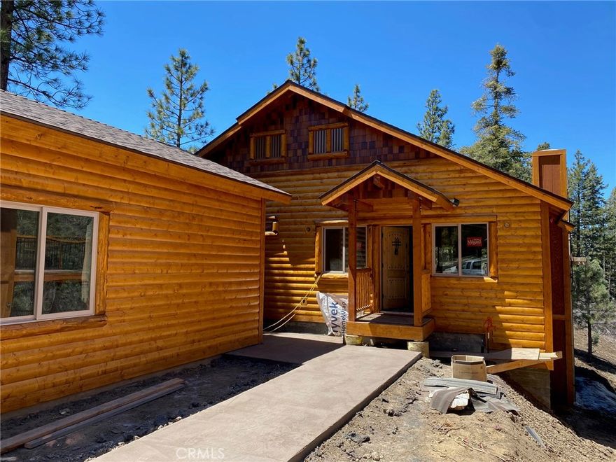 Brand new log style construction in Moonridge with knotty pine accents throughout ~ Quality construction with mountain charm ~ Great room living area with open kitchen, living and dining area ~ Kitchen features hickory cabinetry, granite slab counters, stainless steel appliances (fridge, stove, dishwasher, and microwave) and a cedar breakfast bar ~ Vaulted T&G knotty pine ceilings ~ Level entry with all of your living on one floor ~ Pine doors ~ Oil rubbed bronze fixtures ~ Mountain decor lighting ~ Master bath with slate tile and dual sinks ~ Washer/Dryer in hallway ~ Tile that looks like wood in all the traffic areas ~ Carpert in the bedrooms ~ Large back deck to enjoy the treed setting ~ Huge 576 square foot detached garage which is perfect for parking toys, bikes, kayaks, boat storage, etc or for a pool table/play room? Minutes to ski slopes, lake, shopping, and restaurants ~ Completion of construction expected to be close to Memorial Weekend